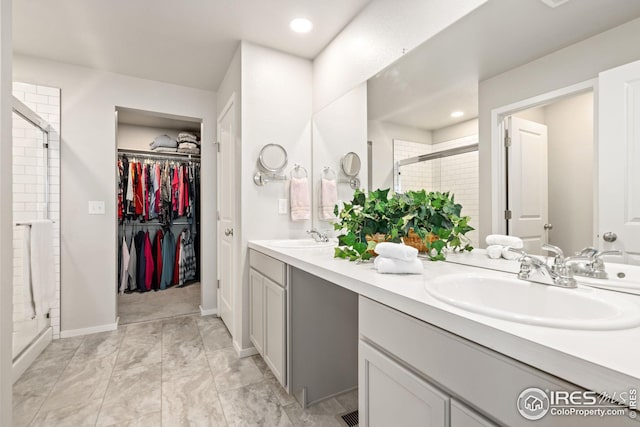 bathroom with vanity and walk in shower