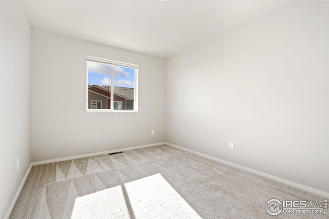 unfurnished room featuring carpet floors