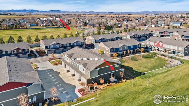 birds eye view of property featuring a mountain view