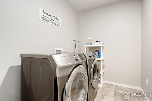 clothes washing area featuring washing machine and dryer