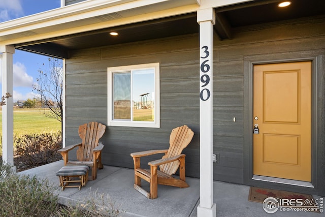 doorway to property featuring covered porch