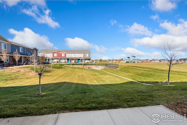 surrounding community featuring a lawn