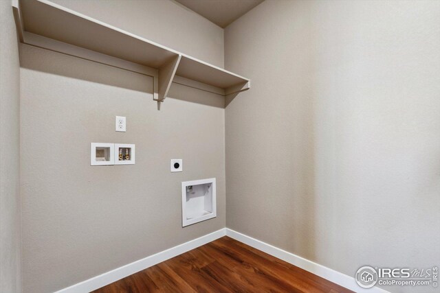 washroom featuring hookup for an electric dryer, hookup for a washing machine, and dark hardwood / wood-style flooring