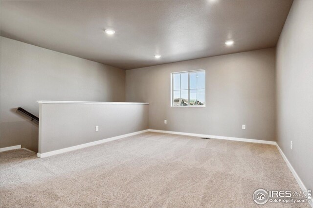 empty room with carpet flooring