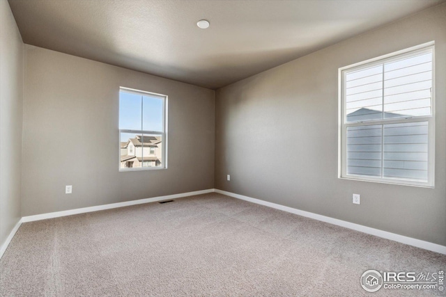 empty room featuring carpet floors