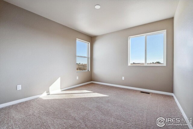 view of carpeted spare room