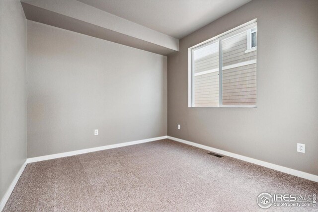 view of carpeted spare room