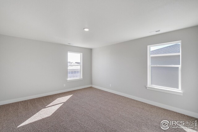 spare room with carpet flooring