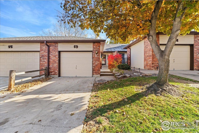 ranch-style house featuring a garage