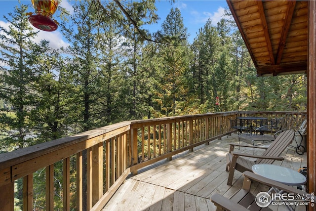 wooden deck with outdoor dining space