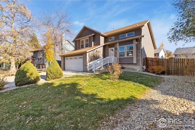 view of front property featuring a garage and a front yard