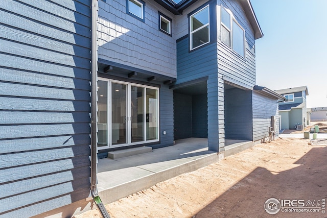 6105 Saddle Horn Dr, Timnath, CO 80547 - view of exterior entry with a patio area