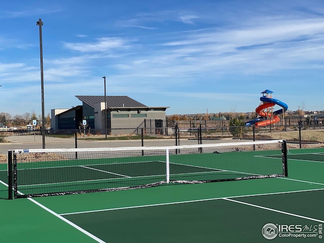 6105 Saddle Horn Dr, Timnath, CO 80547 - view of tennis court with fence