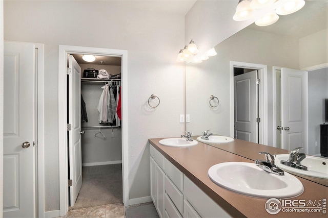 bathroom featuring tile patterned flooring and vanity