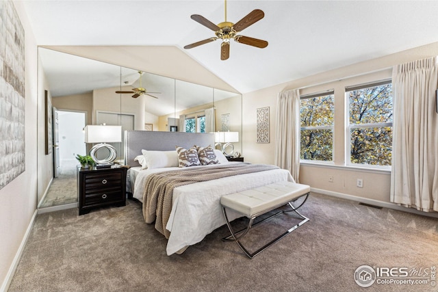 carpeted bedroom featuring ceiling fan and vaulted ceiling