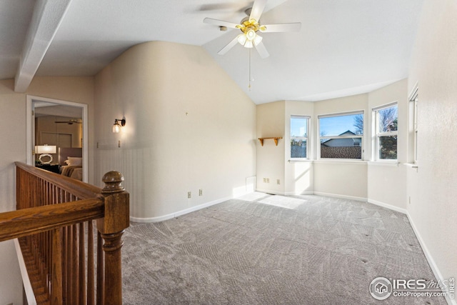 interior space featuring vaulted ceiling with beams and ceiling fan