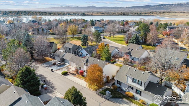 aerial view featuring a water and mountain view