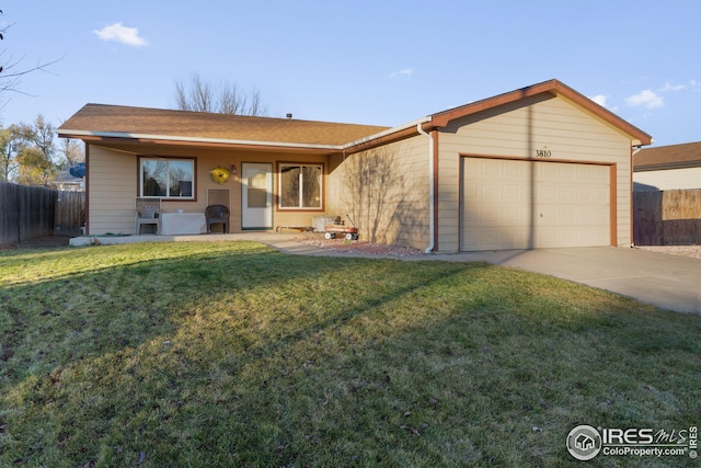 single story home with a front lawn and a garage