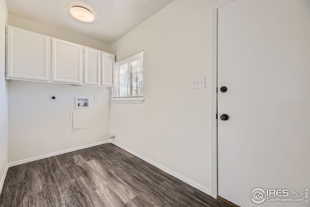 clothes washing area featuring cabinets, hookup for a washing machine, dark hardwood / wood-style floors, and hookup for an electric dryer