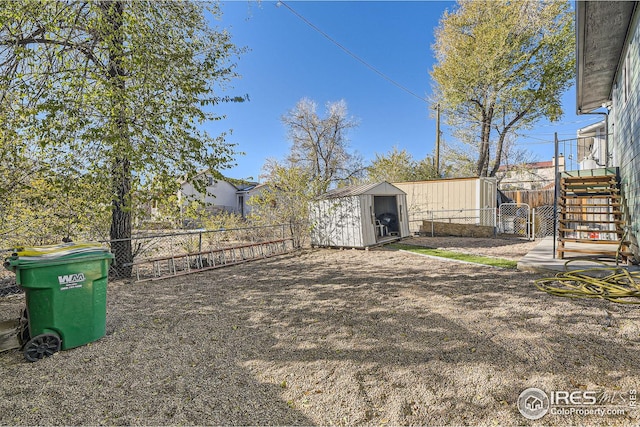 view of yard with a storage unit