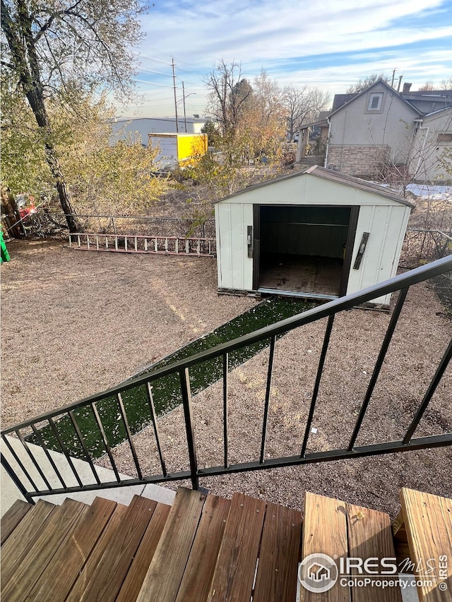 exterior space with a storage shed