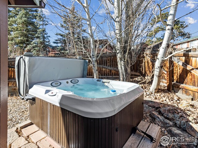 deck featuring a hot tub