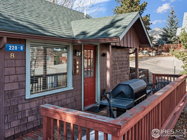 wooden terrace with area for grilling