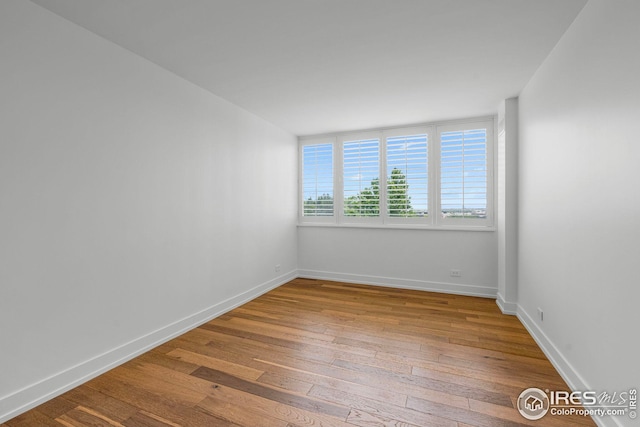 spare room featuring hardwood / wood-style flooring