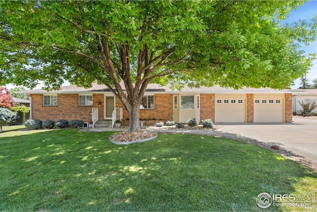 ranch-style house with a garage and a front yard