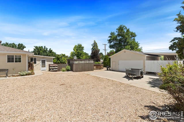 view of yard with an outbuilding and a garage