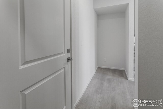 hallway featuring light wood-type flooring