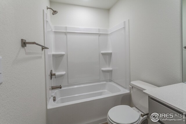 full bathroom featuring vanity, tub / shower combination, and toilet