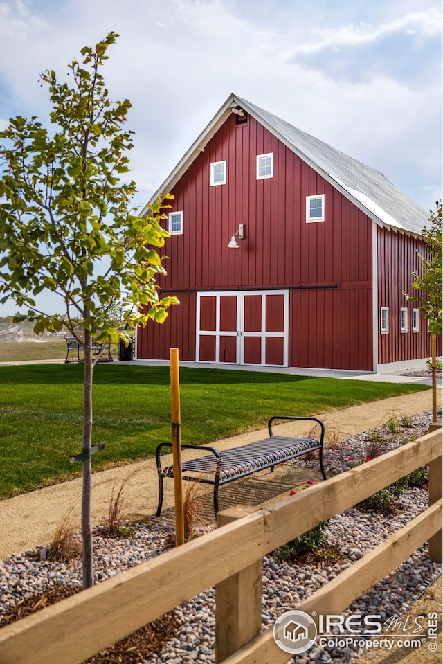 view of outbuilding with a yard