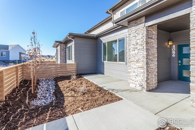 view of side of property featuring a patio