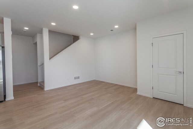 unfurnished room featuring light hardwood / wood-style flooring