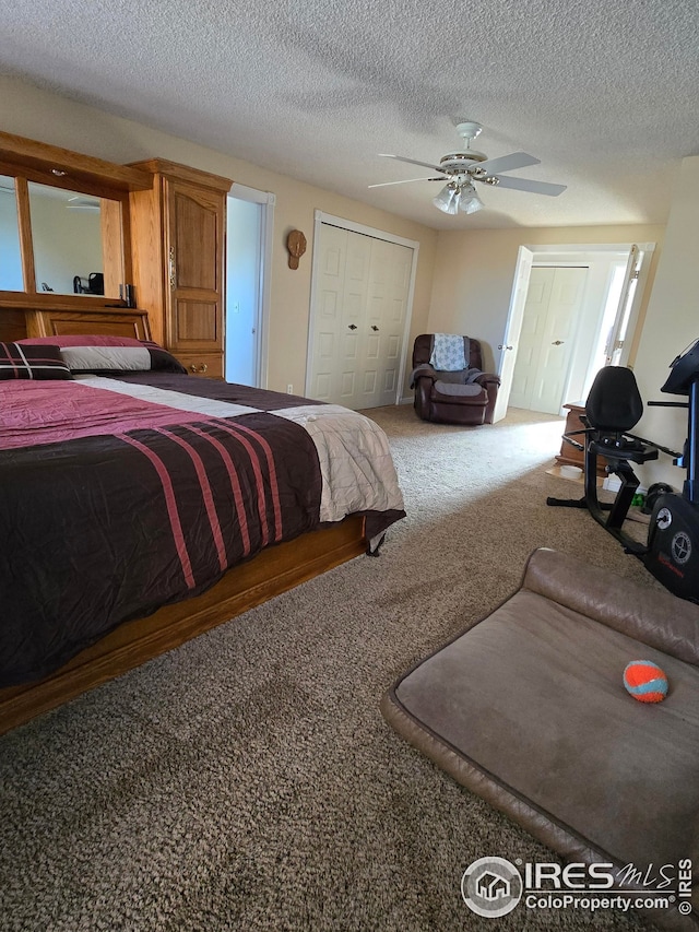 bedroom with carpet flooring, a textured ceiling, and ceiling fan