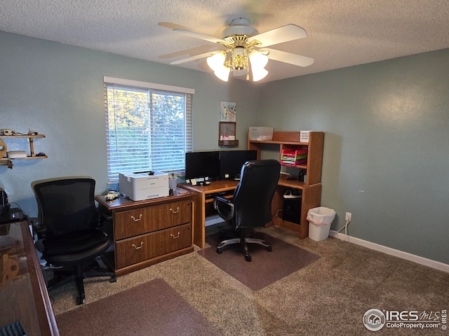 carpeted home office featuring ceiling fan and a textured ceiling