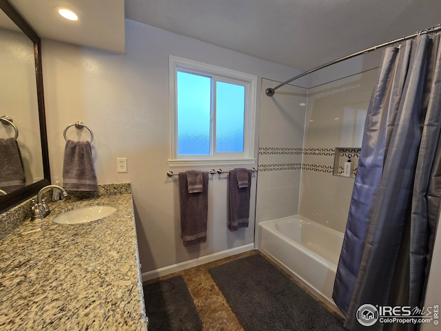 bathroom with vanity and shower / tub combo