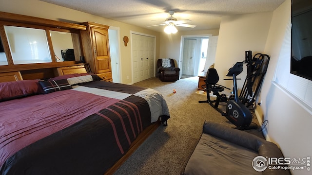 carpeted bedroom featuring a textured ceiling and ceiling fan