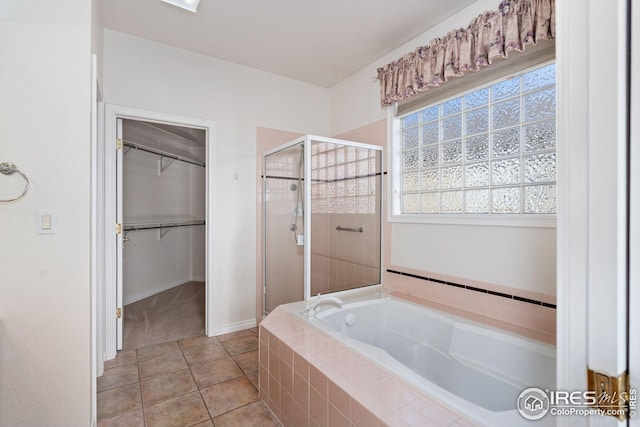 bathroom featuring tile patterned flooring and independent shower and bath