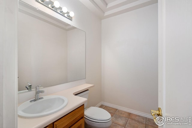 bathroom featuring vanity, tile patterned floors, and toilet