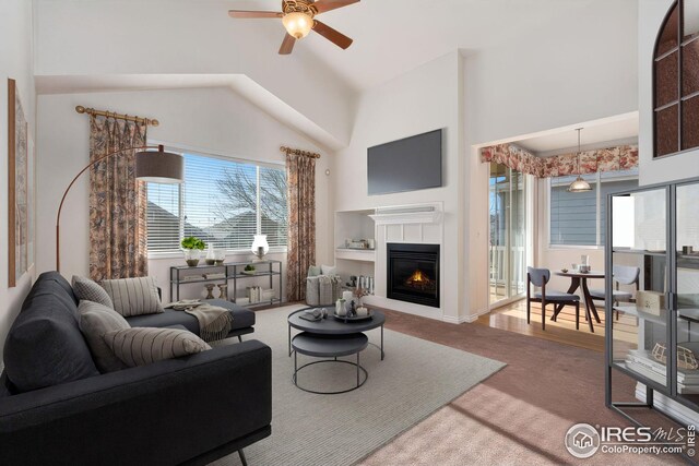 living room featuring ceiling fan and carpet flooring