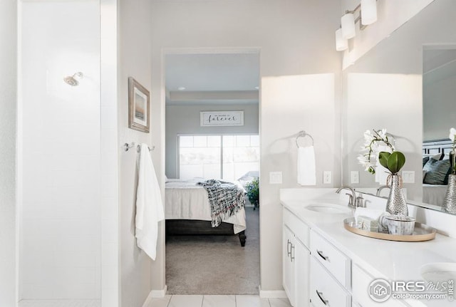 bathroom with tile patterned floors and vanity