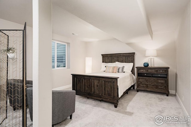 bedroom with light colored carpet