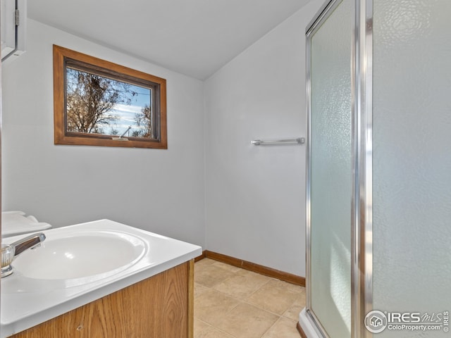 bathroom featuring vanity, tile patterned floors, and an enclosed shower