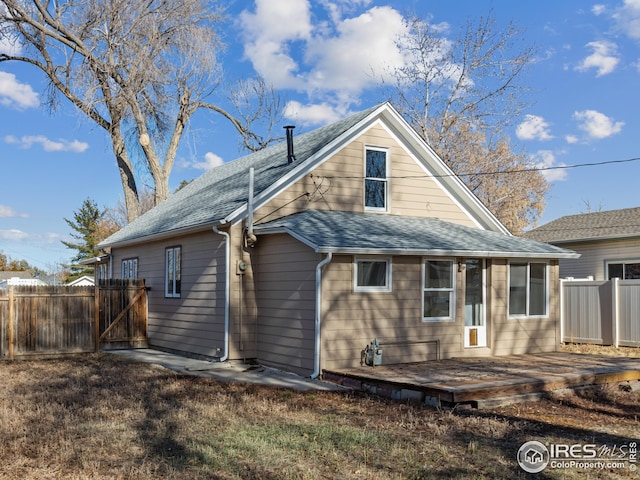 back of property with a deck