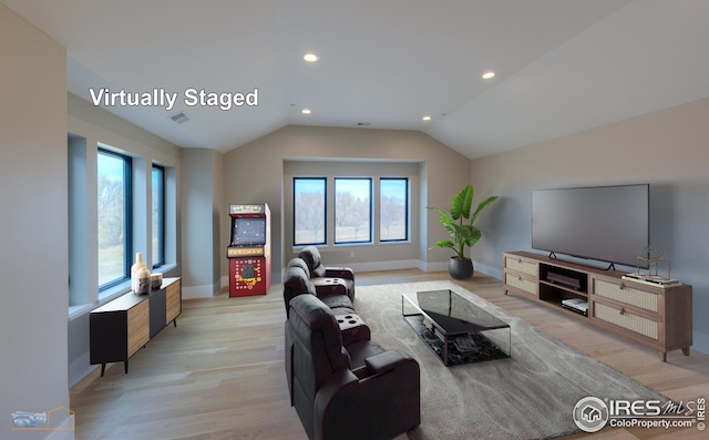 living area with a wealth of natural light and light wood finished floors