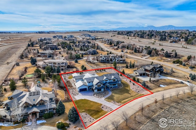aerial view with a residential view and a mountain view