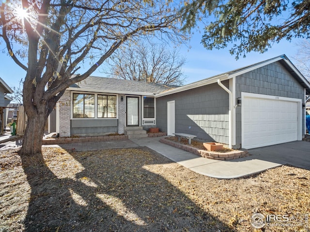 ranch-style home featuring a garage