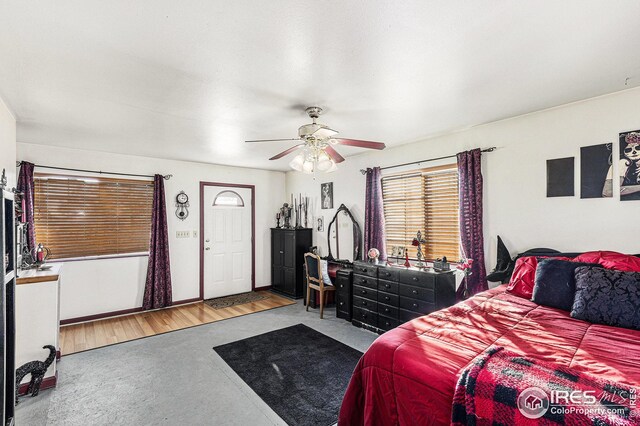 bedroom featuring wood-type flooring and ceiling fan